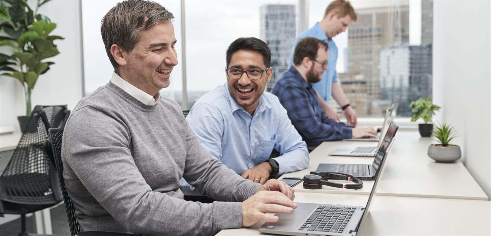 The Intuitive IT engineers working at their desks